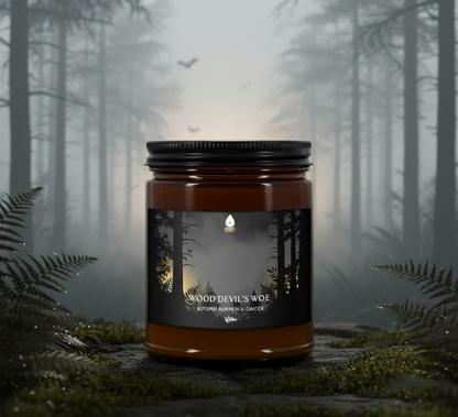 Candle labeled 'Wood Devil's Woe' in a forest setting